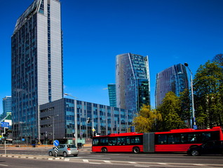 Fototapeta na wymiar Red bus on Konstitucijos Avenue in Vilnius