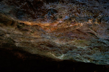 beautiful illuminated sealing of cave different colors