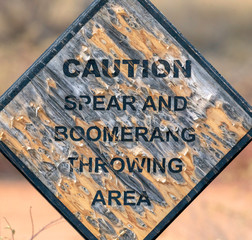 warning sign boomerang and spears