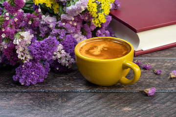 Yellow cup of hot drink.
