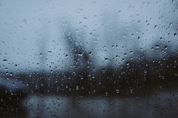 small drops of rain on the car window in the afternoon