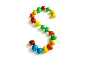 Coated chocolate array on the white background.