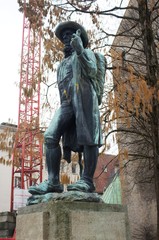 Naklejka premium Leineweber Bielefeld,statue, sculpture, monument, bronze, art, old, stone, architecture, history, blue, ancient, sky, europe, landmark