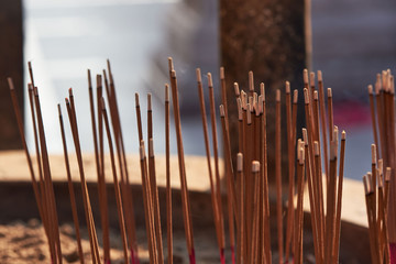 Joss-sticks and smoke in the pot during praying