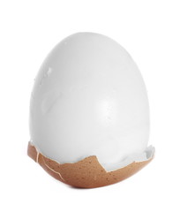 Fototapeta premium Boiled egg with broken shells isolated on white background