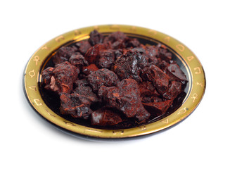 Dragon's blood red resin isolated on white background.