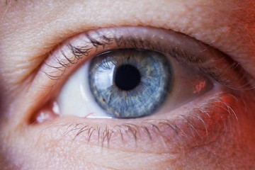 Macro image of human sad blue eye, close-up details