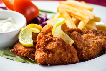 Battered chicken served with sauce in the cafe