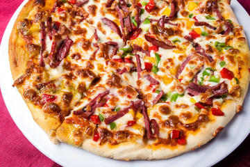 Delicious pizza with with sauces on the table. Food concept