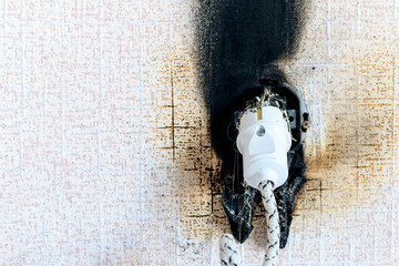 socket on fire. he is real. there is plastic melting