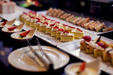 Close up delicious dessert pastry cakes. Fresh colourful sweet berry desserts, beautifull decorated in Egypt