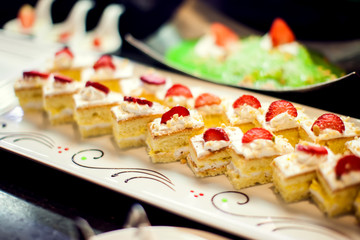 Close up delicious dessert pastry cakes. Fresh colourful sweet berry desserts, beautifull decorated in Egypt