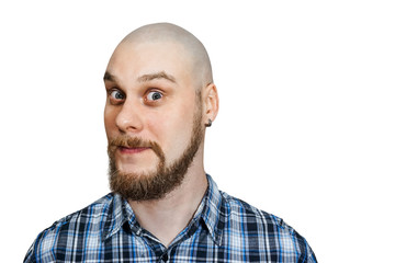 portrait of a serious, pensive, bald guy with a beard with narrowed eyes looking at the camera on an isolated background