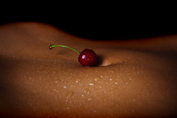 Seductive body. A young woman is eating cherries. Berries for an erotic evening. The girl lies on the bed before sex. Art for the body. Naked woman with a delicious berry. Food and body - 252457982