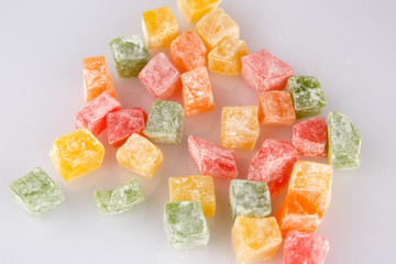 Different colours Turkish delight isolated on white background.