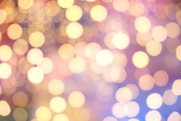Abstract circular golden light bokeh background.