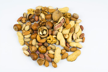 Assortment of different nuts isolated on a white background.