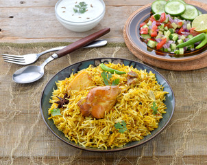 Chicken Biryani, a deleciously colorful rice dish filled with spicy marinated chicken  along with...