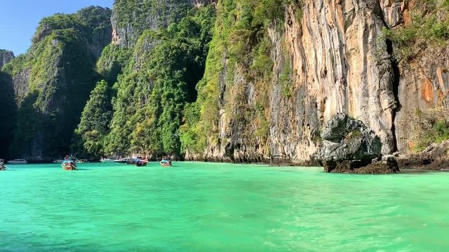 Beautiful tropical Islands and lagoons Thailand travel on a traditional long-tail boat