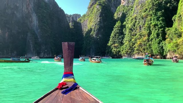 Beautiful tropical Islands and lagoons Thailand travel on a traditional long-tail boat