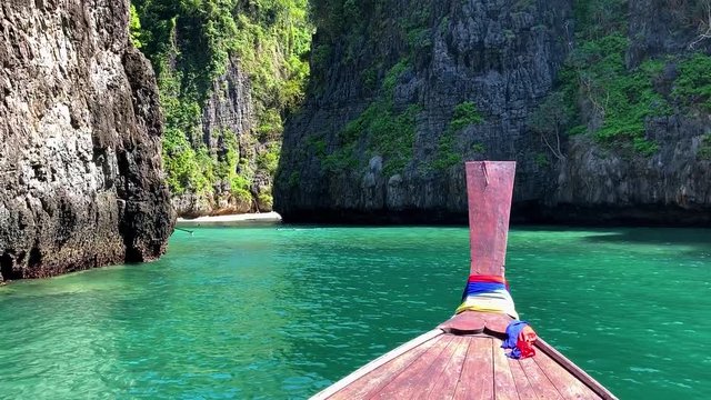Beautiful tropical Islands and lagoons Thailand travel on a traditional long-tail boat