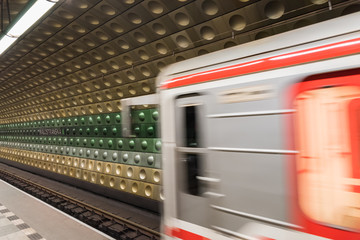 Train in motion at Malostranská metro station 