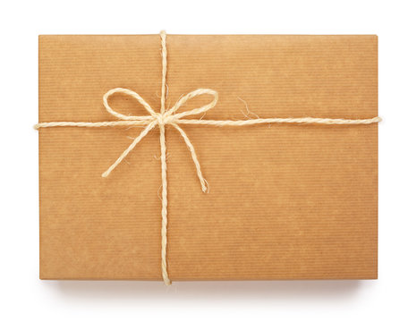 Top view of a wrapped parcel in brown paper, tied with rope and knot. Isolated on white background. Contains clipping path.