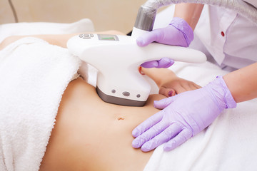 Naklejka premium Body Care. Woman is in the process at the clinic lipomassage