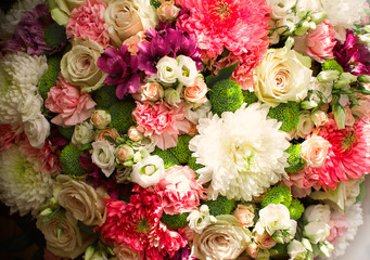 Many colored flowers.Bouquet of roses and pions