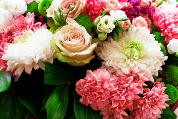 Many colored flowers.Bouquet of roses and pions