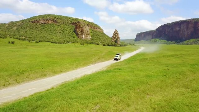 Aerial of a 4 WD safari jeep driving in Hell's Gate National park, Rift Valley, Kenya, Africa.