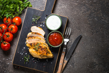 Chicken steak with sauces top view.