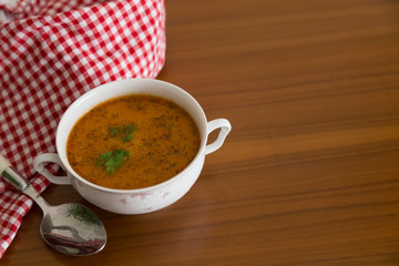 the Tarhana soup in the bowl that the woman hold it for kitchen and food concept. 