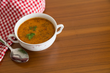 the Tarhana soup in the bowl that the woman hold it for kitchen and food concept. 