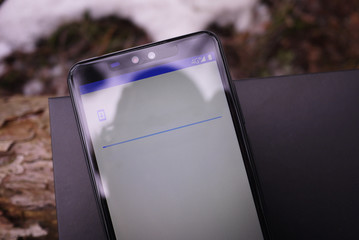 Modern smartphone based on the Android operating system. Details, close-up.