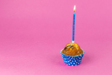 Happy birthday baked cakes with candels and flames on pink background. Party, dessert concept