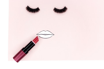 Obraz premium lipstick, tools, eyeliner, blush on, eye shadow and powder cosmetic in pink theme make up on frame for promotion