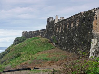 Medium wide shot of the Fort San Cristobal or Castillo San Cristobal beside the ocean, Old San Juan, Puerto Rico