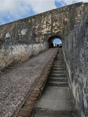 Narrow uneven cement stairs going up to the Plaza de Armas, the main plaza of the El Morro Fort, Old San Juan, Puerto Rico