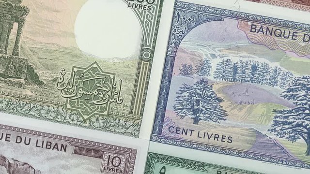 Old Lebanon pound banknotes slow rotating. Lebanese money currency. Lebanon economy. 4K stock video footage.