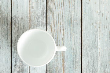 Fototapeta na wymiar a empty white coffee cup on white background with copyspace