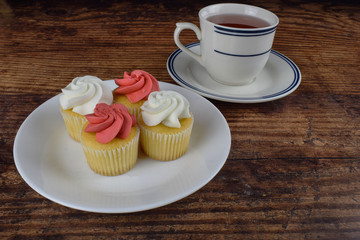mini cup cakes and and a cup of tea