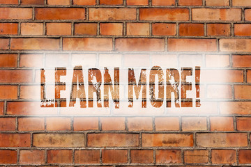 Writing note showing Learn More. Business photo showcasing Study harder Develop new skills abilities Get extra education Brick Wall art like Graffiti motivational call written on the wall