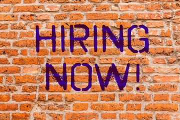 Conceptual hand writing showing Hiring Now. Business photo showcasing Workforce Wanted New Employees Recruitment Brick Wall art like Graffiti motivational written on wall