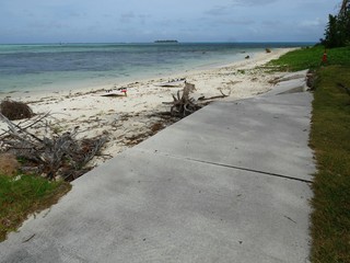 Debris from uprooted trees and littered the white sand Micro Beach after Typhoon Soudelor which hit Saipan in 2015 