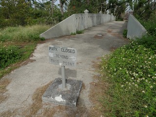 A sign near the bridge to inform people the American Memorial Park was closed for joggers and walkers after Typhoon Soudelor hit Saipan in 2015 
