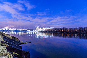 Obraz premium WARSAW, POLAND - FEBRUARY 14, 2019:Night illumination of the National Stadium in Warsaw, February 2019. High-tech venue for sporting events, gigs and park during summer, plus a choice of guided tours.