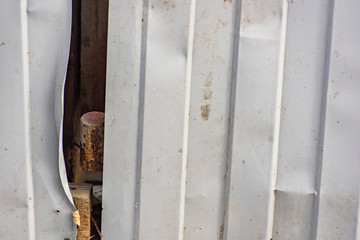 Crumpled corrugated fence