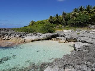 The famous swimming hole bordered by corals and rocks on Rota, an island in the Northern Mariana Islands.