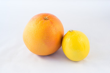 Grapefruit and lemon fruit isolated on white background